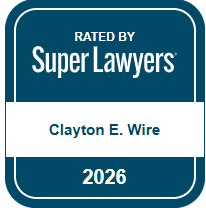 Badge showing ‘Rated by Super Lawyers’ with the name Clayton E. Wire and the year 2026.