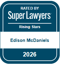 Badge showing ‘Rated by Super Lawyers Rising Stars’ with the name Edison McDaniels and the year 2026.