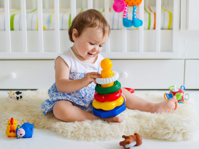 Toddler playing with toys - Toy Safety Awareness