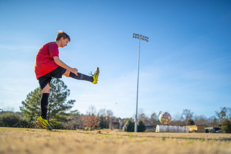 Kid playing soccer