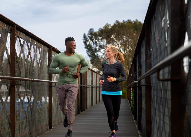 Man and Woman running outdoors